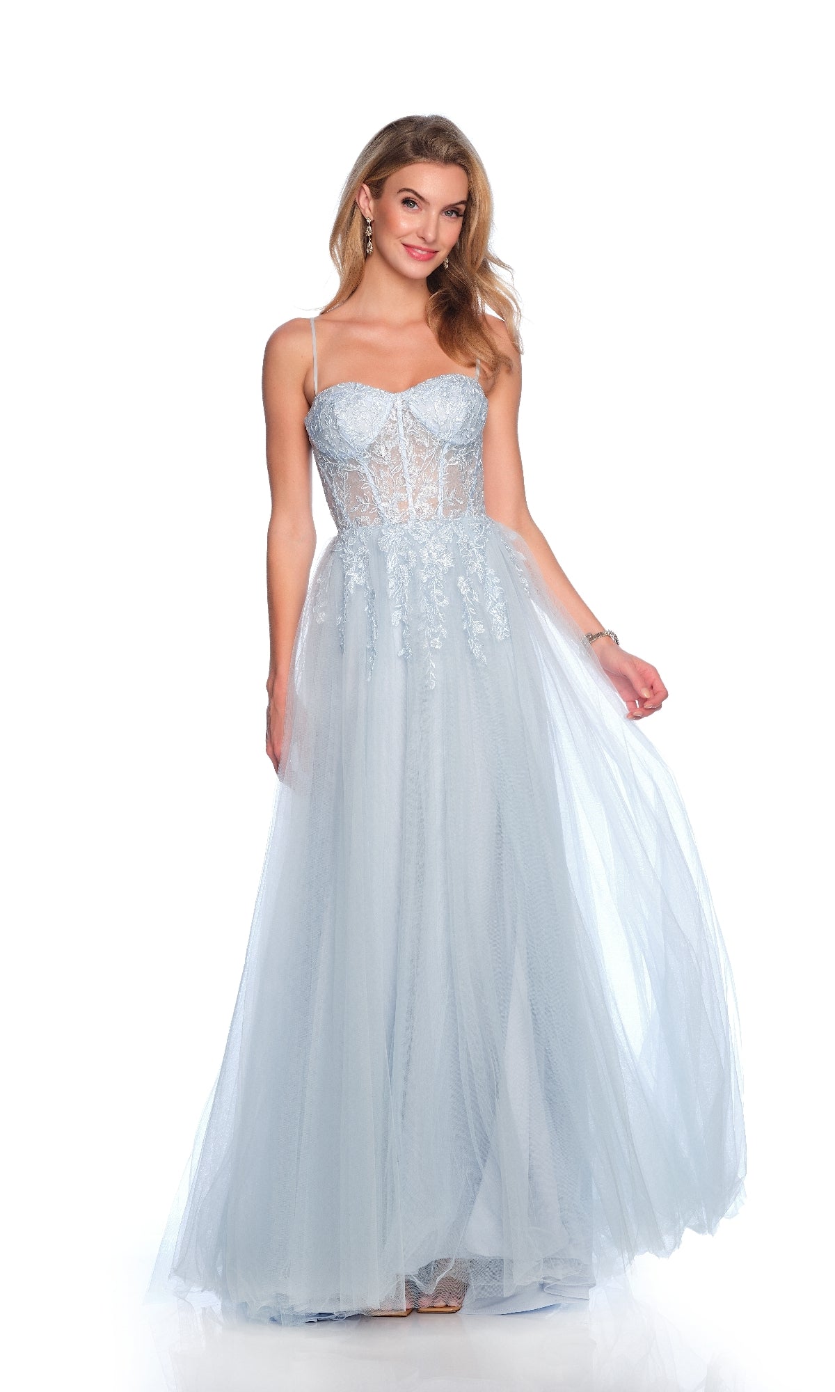 A woman models the Dave and Johnny 12090 Long Prom Dress, showcasing its light blue sheer corset bodice and elegant floor-length A-line tulle skirt against a white background.